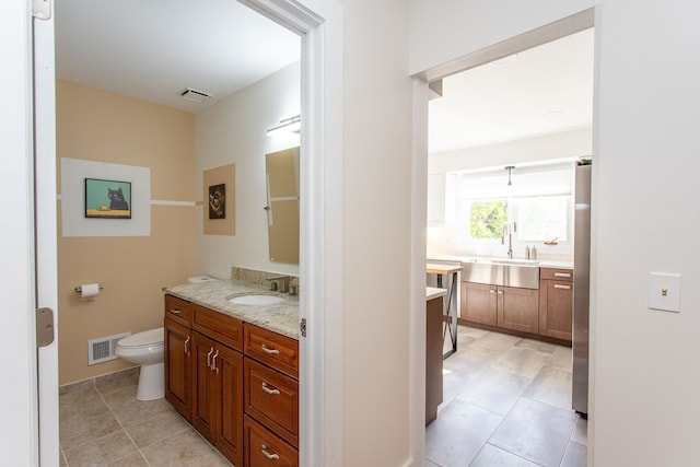 bathroom with toilet and vanity