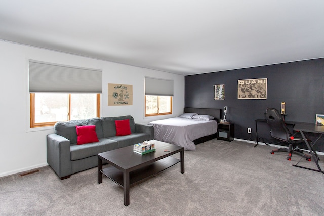 bedroom with light colored carpet