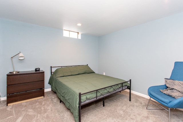 bedroom featuring light carpet