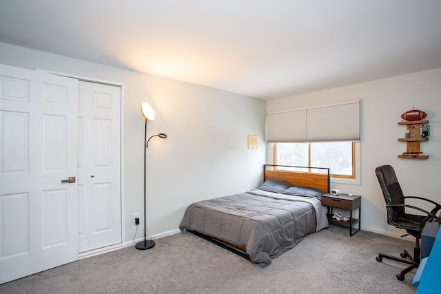 carpeted bedroom with a closet