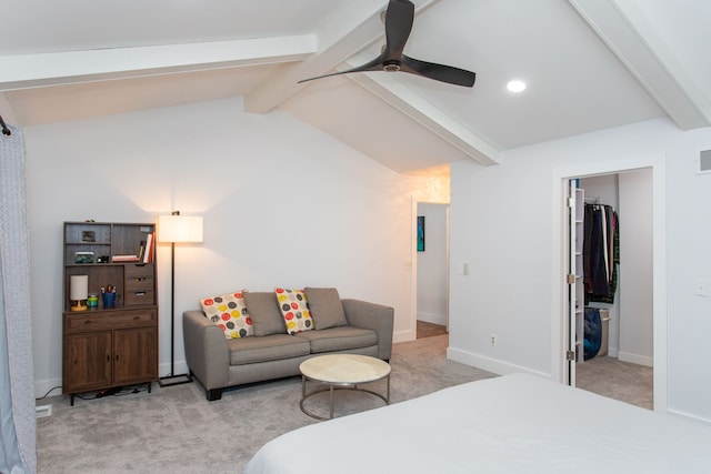 carpeted bedroom featuring ceiling fan, a spacious closet, and lofted ceiling with beams