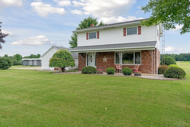 front facade featuring a front yard and a porch