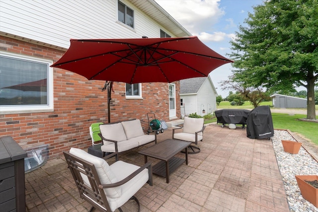 view of patio / terrace featuring outdoor lounge area and a grill