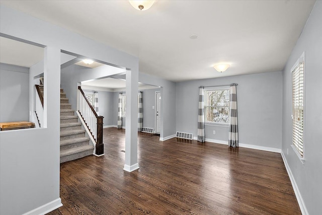 foyer with dark hardwood / wood-style flooring