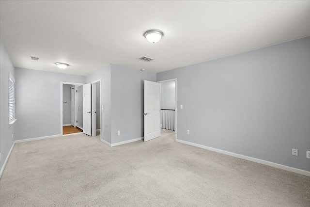 unfurnished bedroom with light carpet