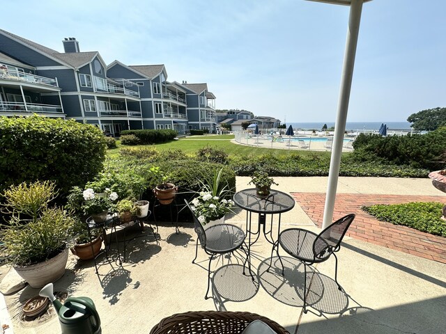 view of patio with a community pool