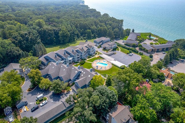 drone / aerial view with a water view and a residential view