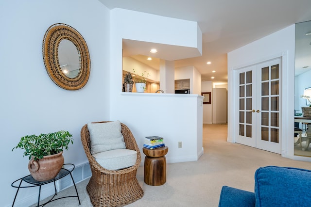 sitting room with recessed lighting, french doors, light carpet, and baseboards