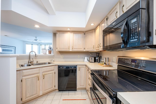 kitchen featuring recessed lighting, light countertops, black appliances, a sink, and light tile patterned flooring