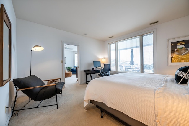 bedroom with light colored carpet and visible vents