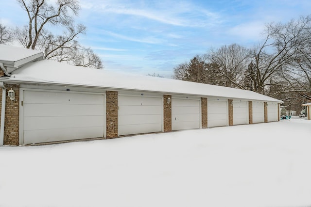 view of snow covered garage