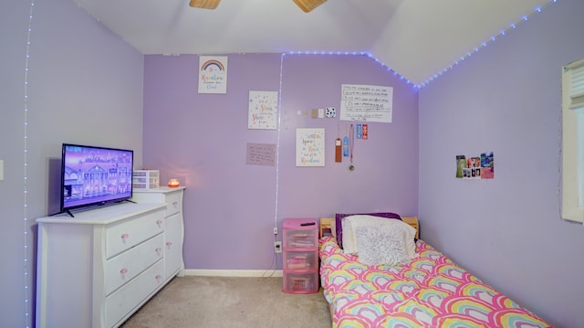 bedroom featuring ceiling fan, light colored carpet, and vaulted ceiling