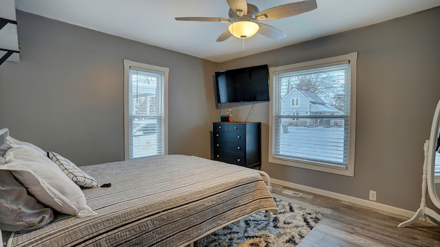 bedroom featuring ceiling fan and hardwood / wood-style floors