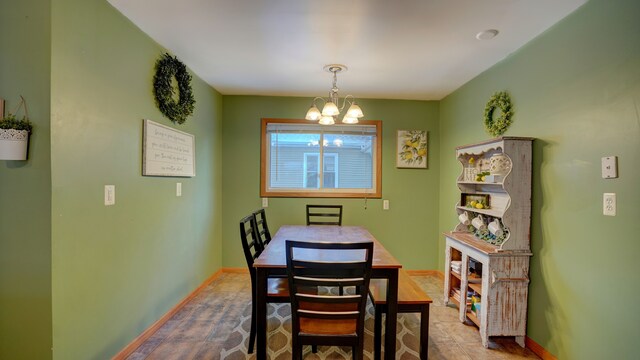 dining space with a chandelier