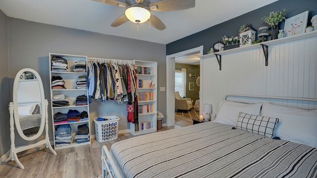 bedroom featuring light wood-type flooring and ceiling fan