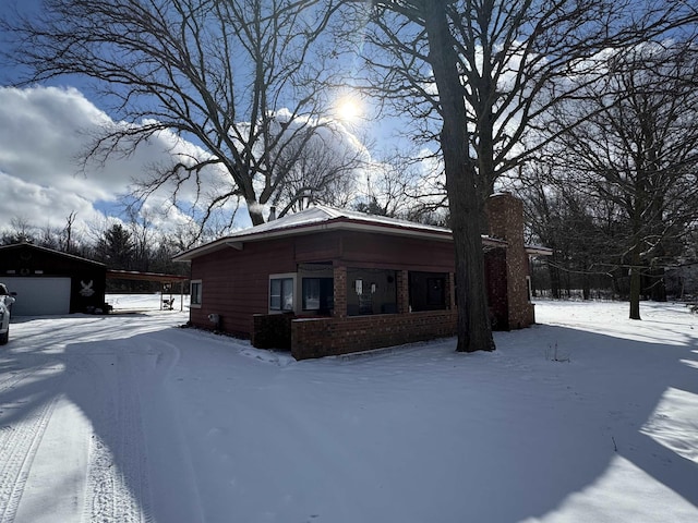 view of front of home featuring a garage and an outdoor structure