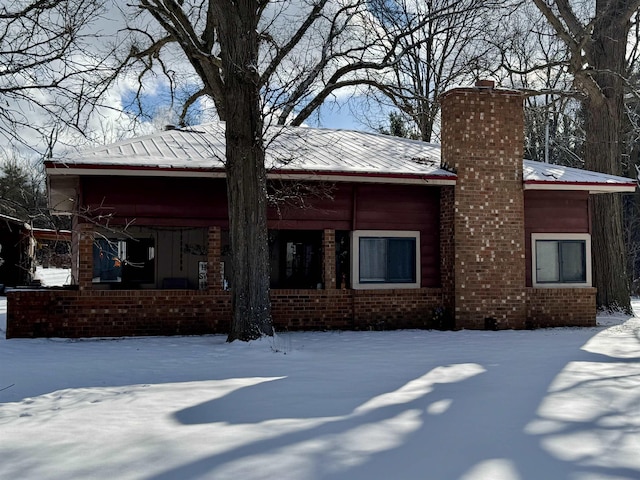 view of snow covered house