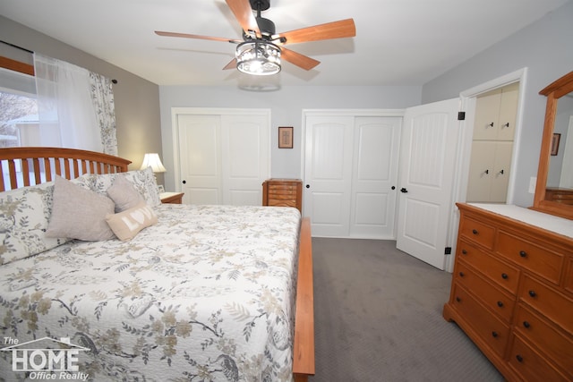 carpeted bedroom featuring ceiling fan and two closets