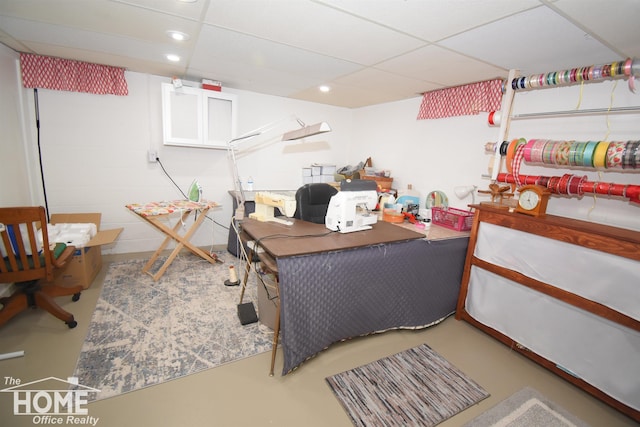 office featuring recessed lighting, finished concrete flooring, and a paneled ceiling