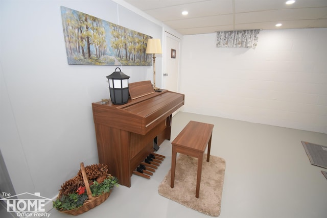 interior space featuring a drop ceiling and recessed lighting