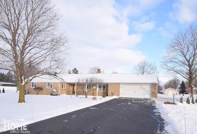 single story home featuring a garage