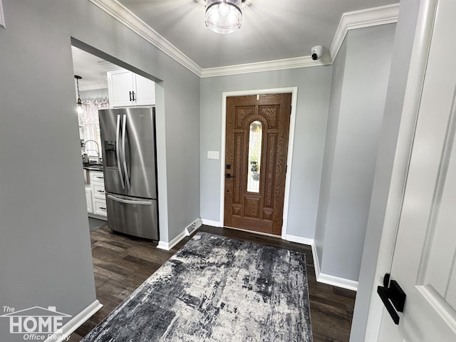 200 Elmwood Dr, Corunna, MI 48817 - entrance foyer with crown molding, baseboards, and dark wood-style floors
