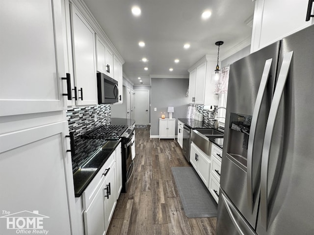 200 Elmwood Dr, Corunna, MI 48817 - kitchen featuring appliances with stainless steel finishes, a sink, recessed lighting, decorative backsplash, and ornamental molding