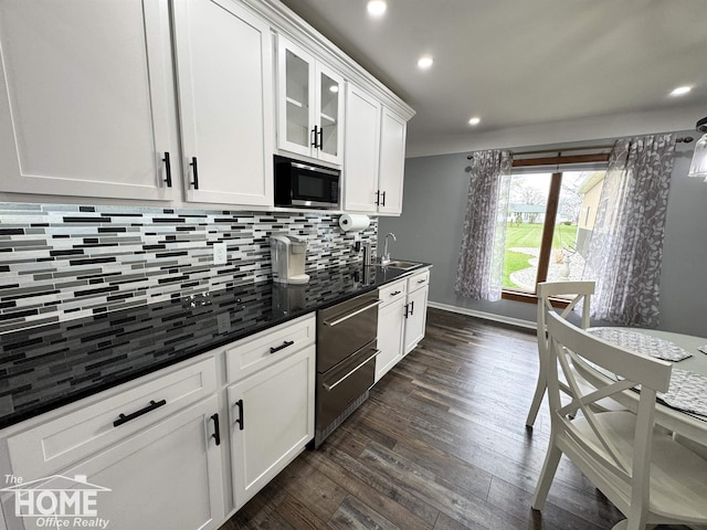 200 Elmwood Dr, Corunna, MI 48817 - kitchen with white cabinets, built in microwave, recessed lighting, dark wood-type flooring, and backsplash