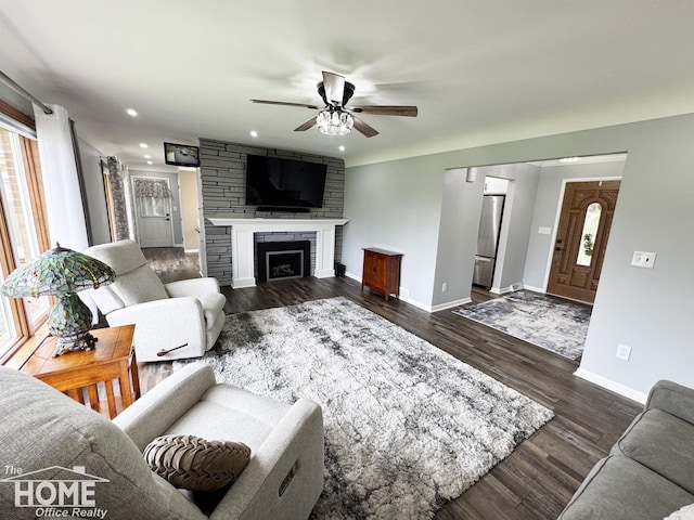 200 Elmwood Dr, Corunna, MI 48817 - living room with baseboards, dark wood-style floors, recessed lighting, a large fireplace, and a ceiling fan