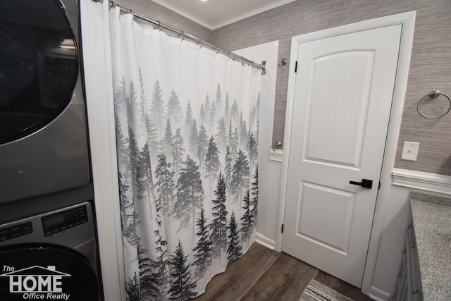 200 Elmwood Dr, Corunna, MI 48817 - bathroom with wood finished floors, stacked washer / dryer, and curtained shower