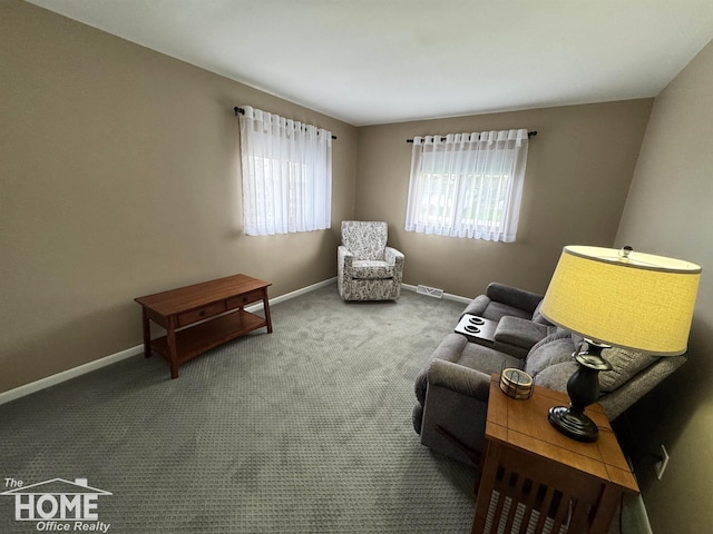 200 Elmwood Dr, Corunna, MI 48817 - living area with baseboards, carpet, and visible vents