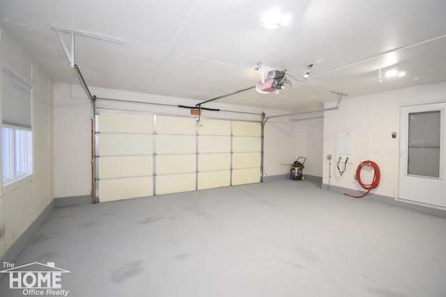200 Elmwood Dr, Corunna, MI 48817 - garage featuring a garage door opener