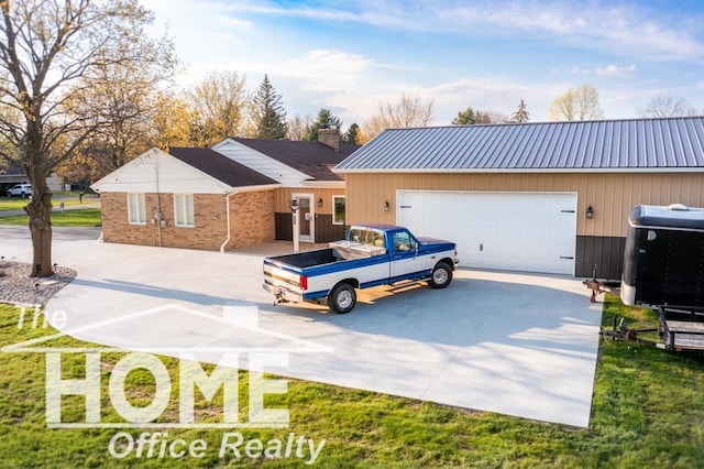 200 Elmwood Dr, Corunna, MI 48817 - ranch-style home featuring driveway, a chimney, metal roof, a garage, and brick siding