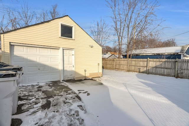 view of snow covered garage