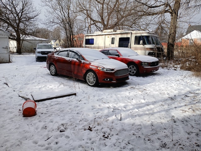 view of snow covered parking