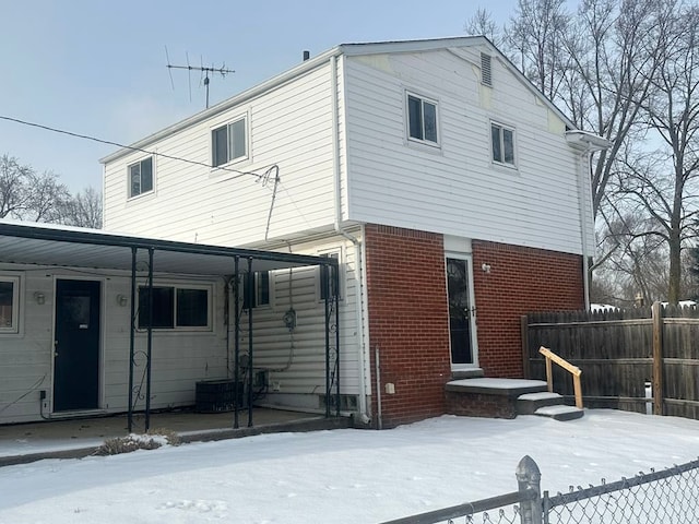 view of snow covered house