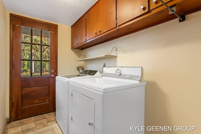 clothes washing area with cabinets and independent washer and dryer