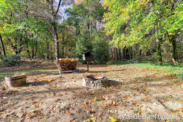 view of yard with an outdoor fire pit