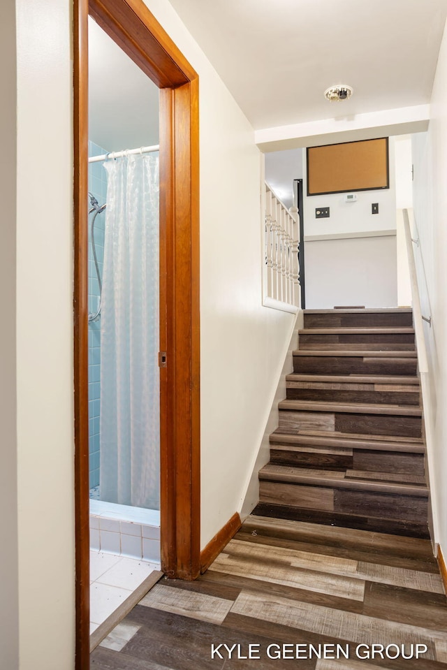 stairway featuring hardwood / wood-style floors