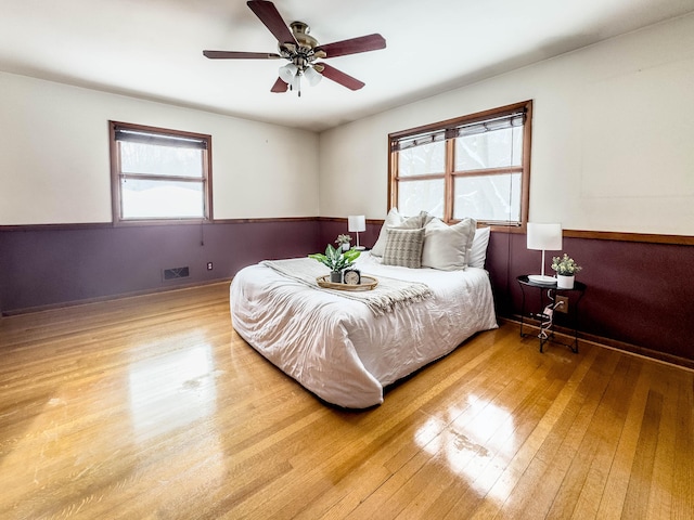 bedroom featuring wood-type flooring and ceiling fan