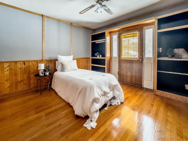 bedroom featuring hardwood / wood-style flooring and ceiling fan