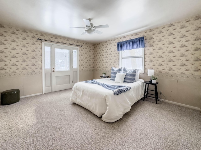 carpeted bedroom with multiple windows and ceiling fan