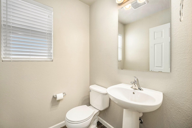 bathroom with sink and toilet