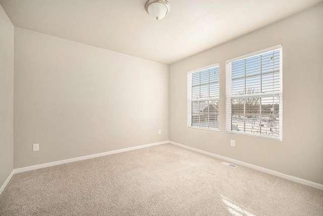 spare room featuring carpet floors