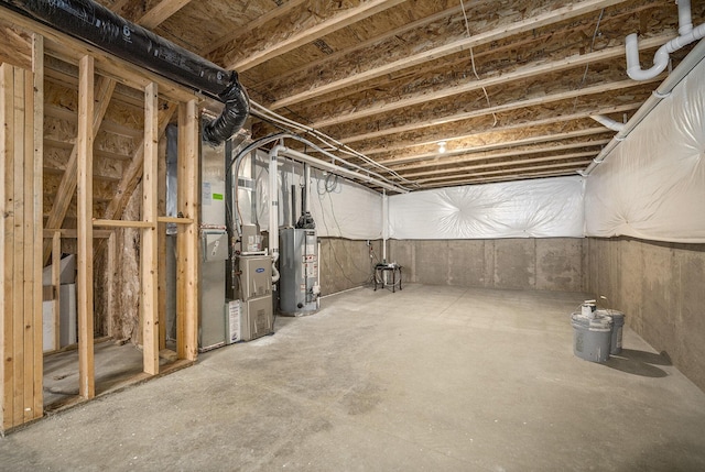 basement featuring heating unit and water heater