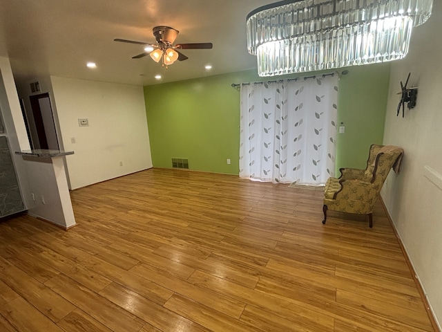 interior space with light hardwood / wood-style flooring and ceiling fan