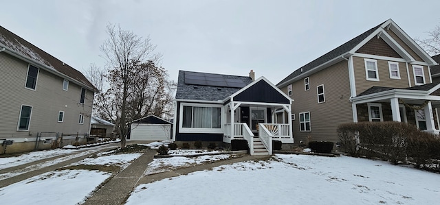 view of front facade featuring solar panels