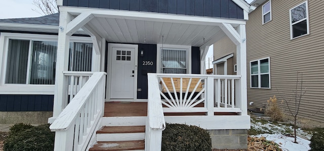 view of snow covered property entrance