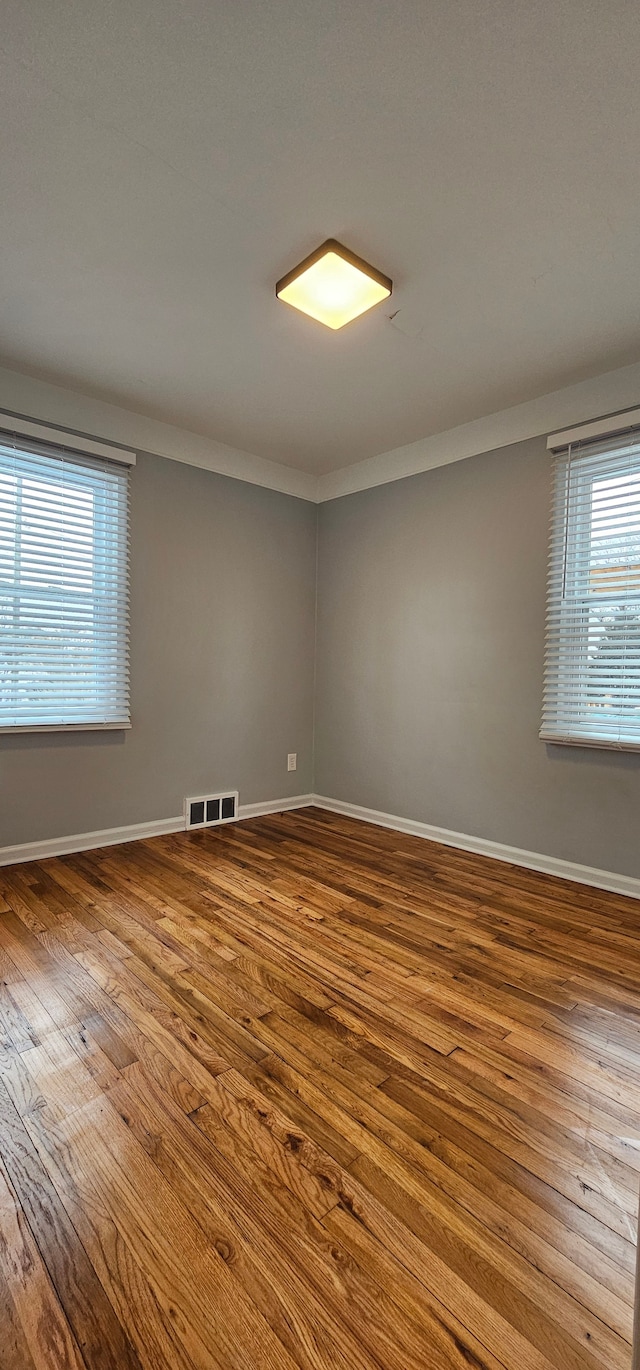 empty room featuring hardwood / wood-style floors