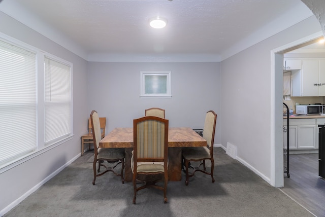 dining area with carpet flooring